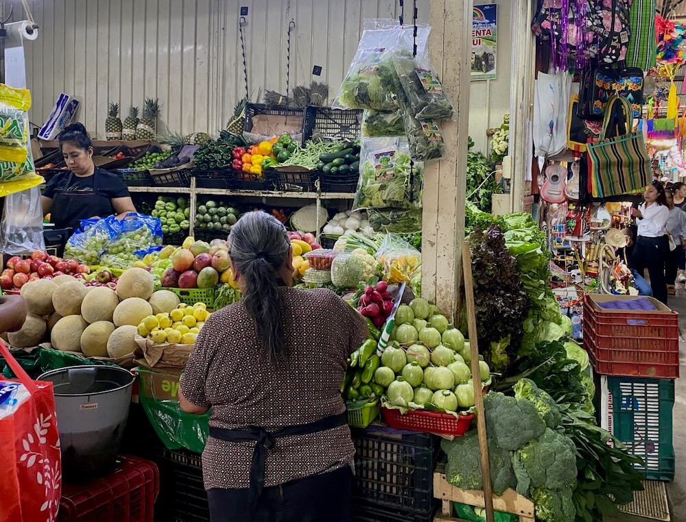 Fruit and vegetable stand at market in Oaxaca Mexico.