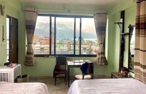 Small apartment with big windows and a view, good natural light with a working table and a view of the hills.